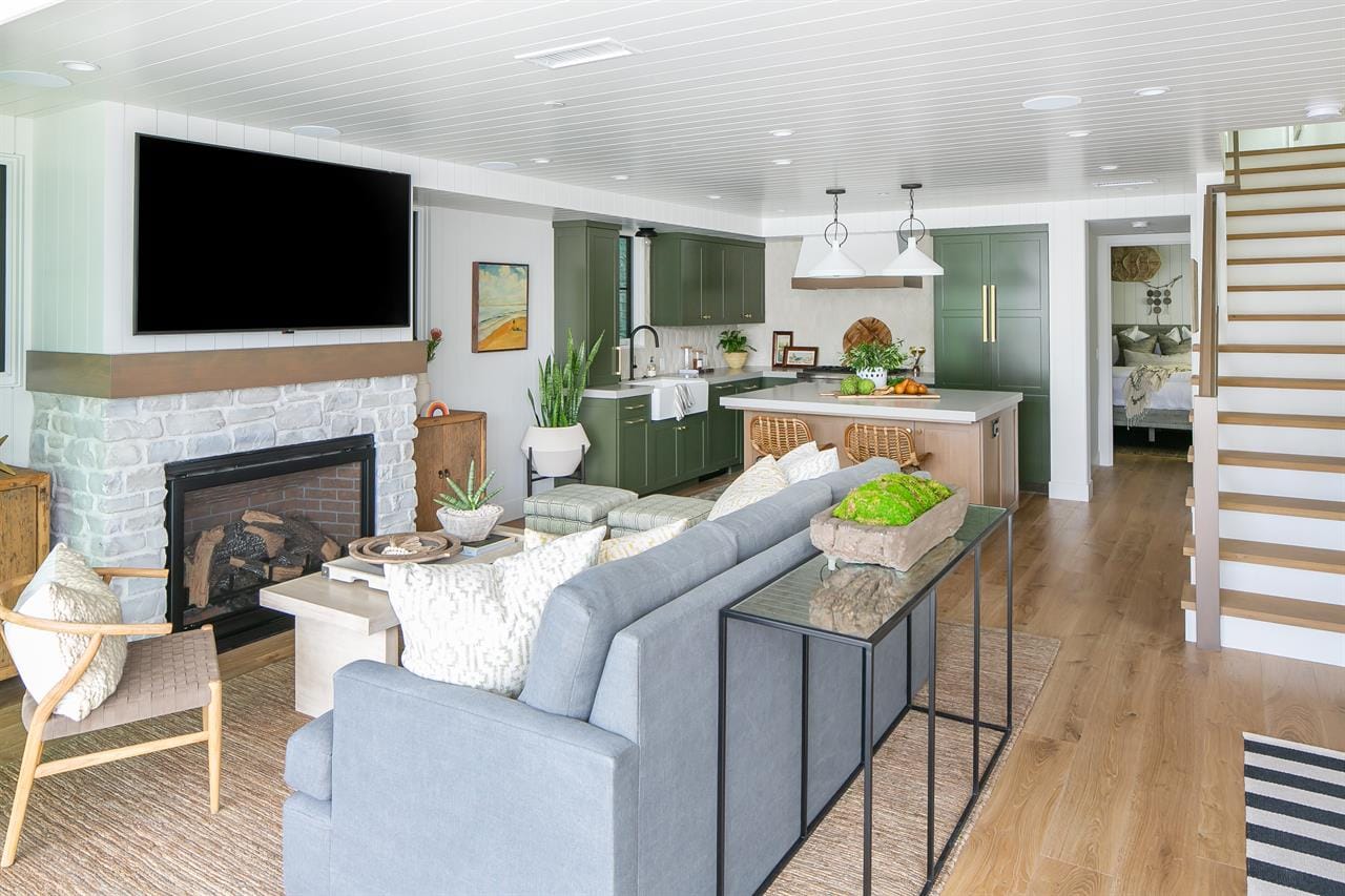 Modern living room with kitchen area.