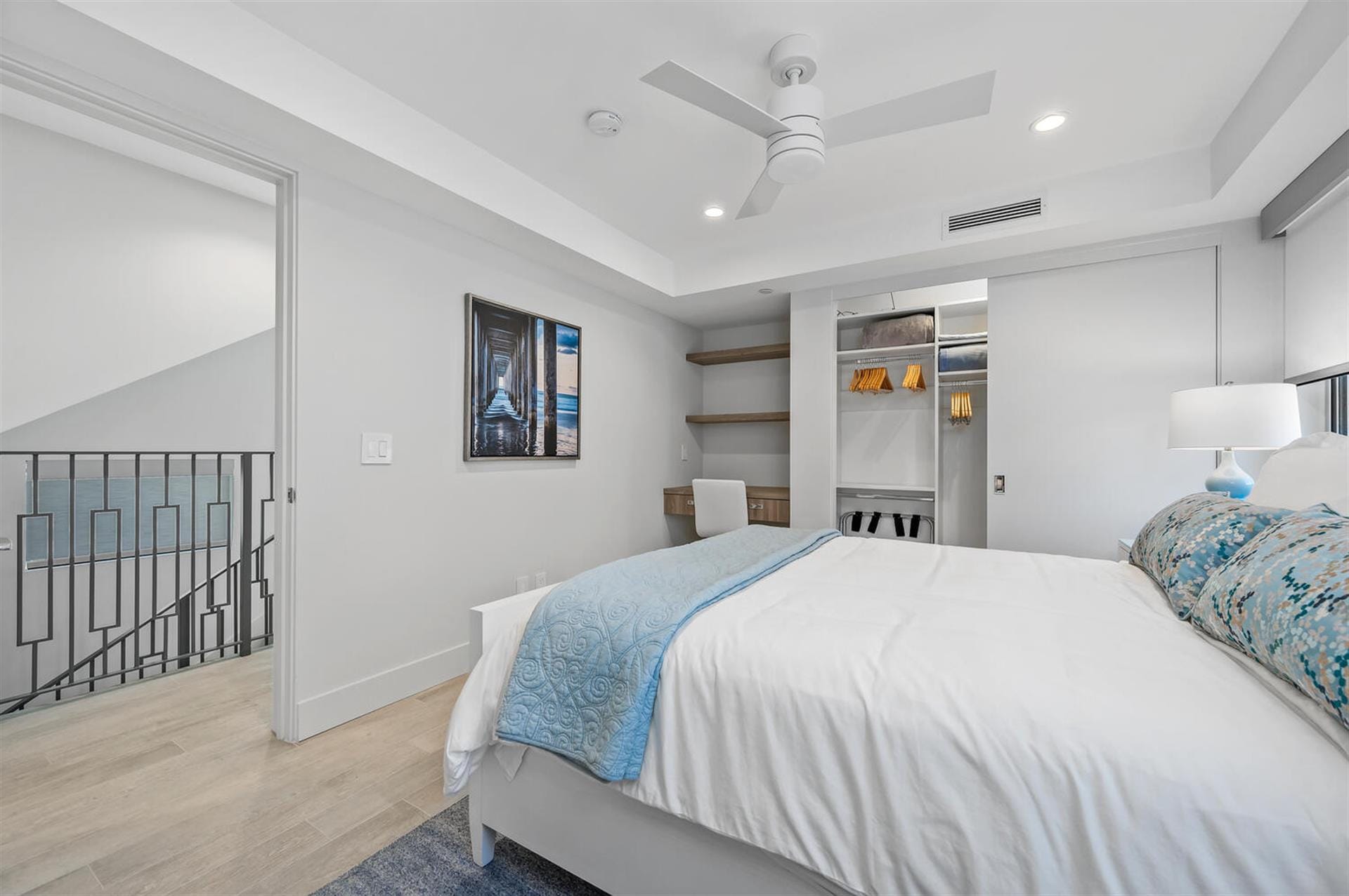 Modern bedroom with open closet.