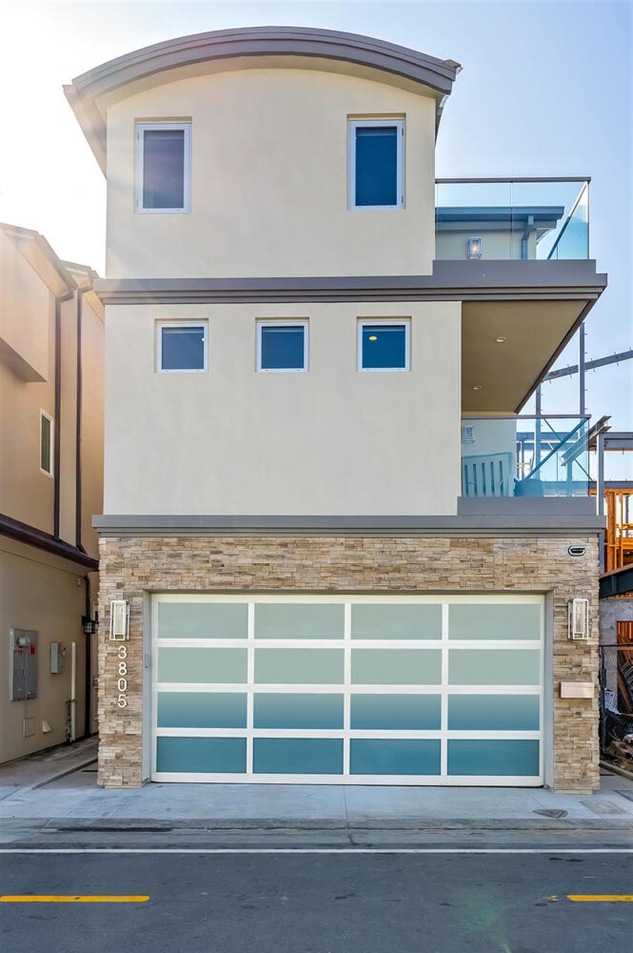 Contemporary three-story house exterior.