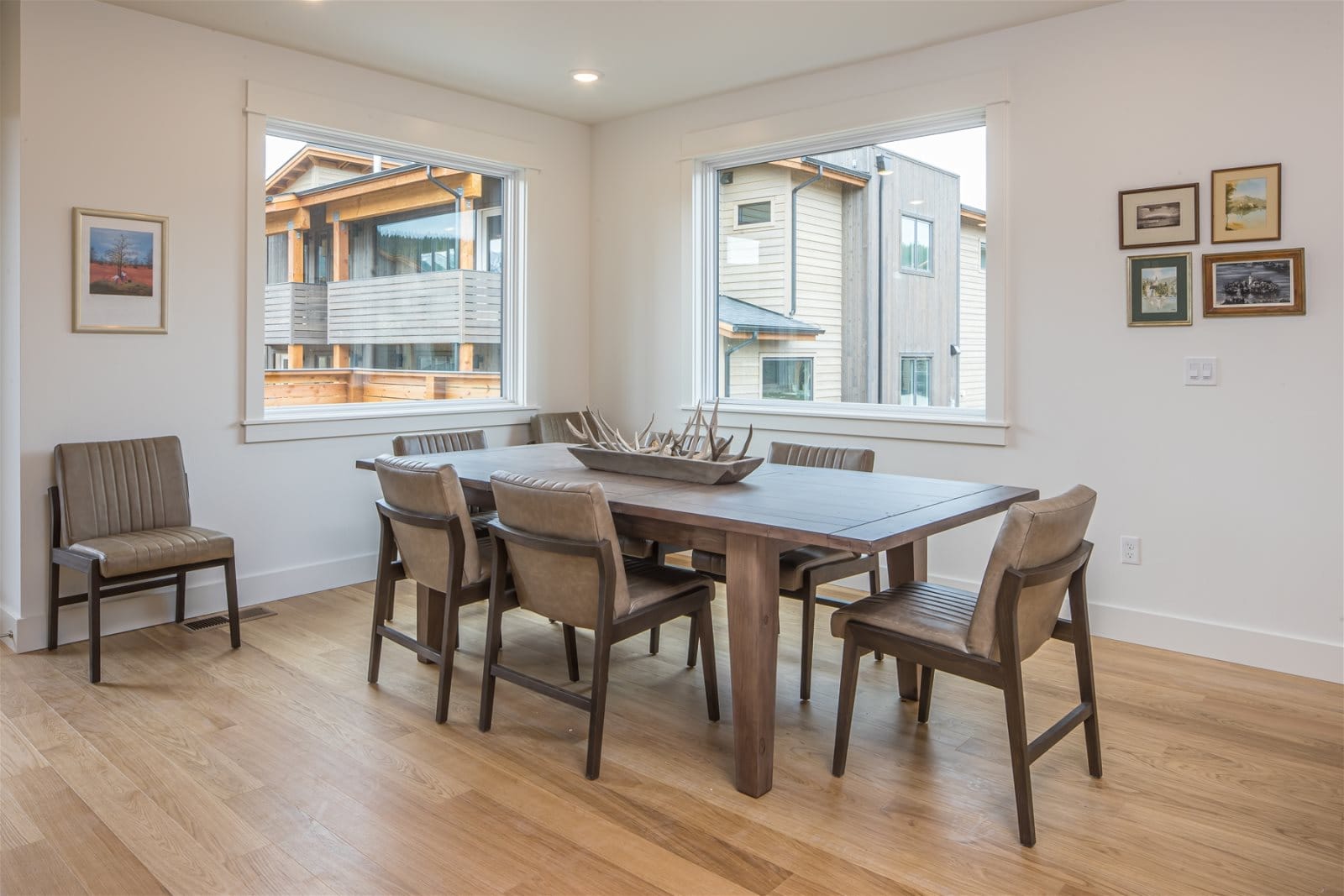 Modern dining room with wooden table.