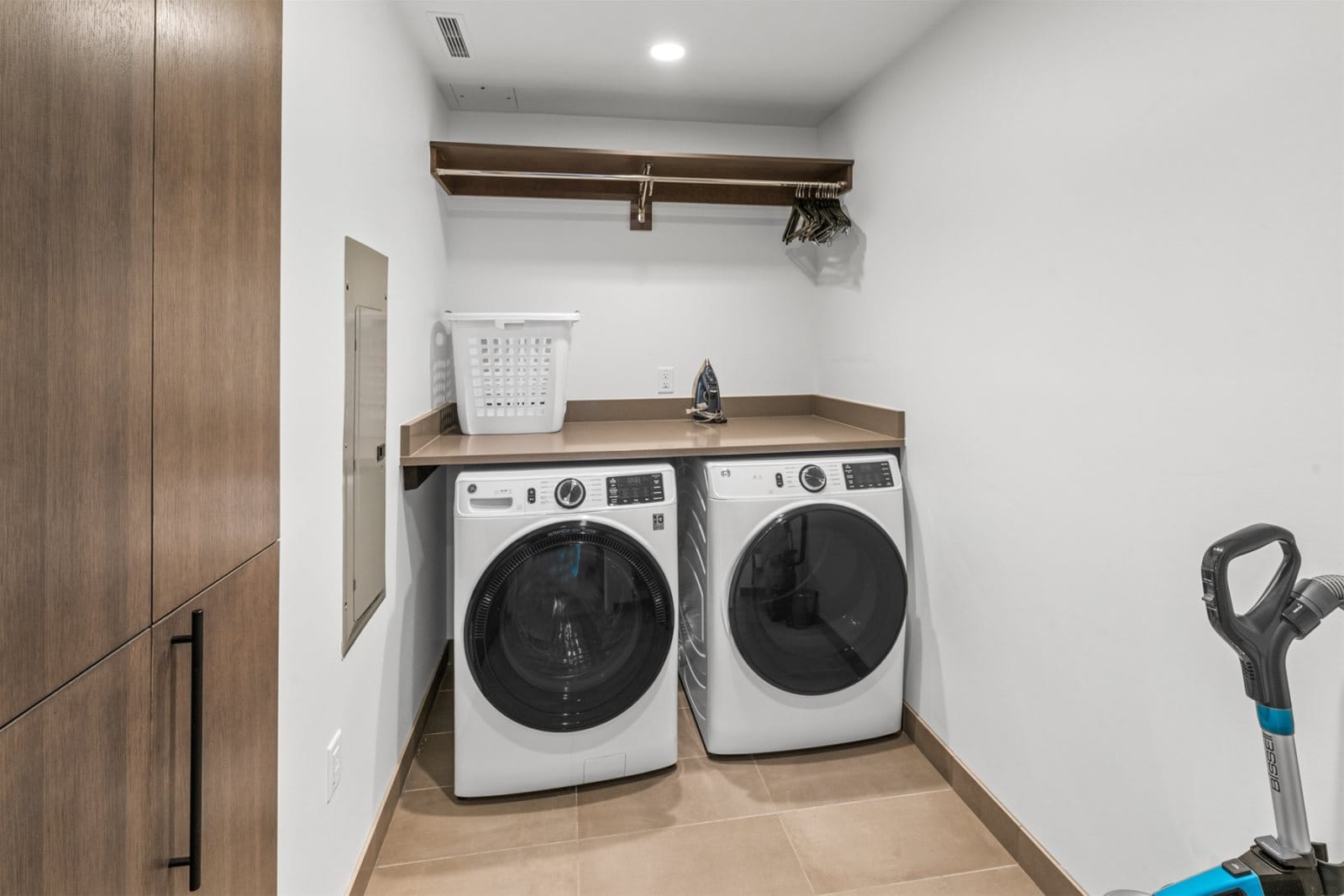 Modern laundry room with washer-dryer.