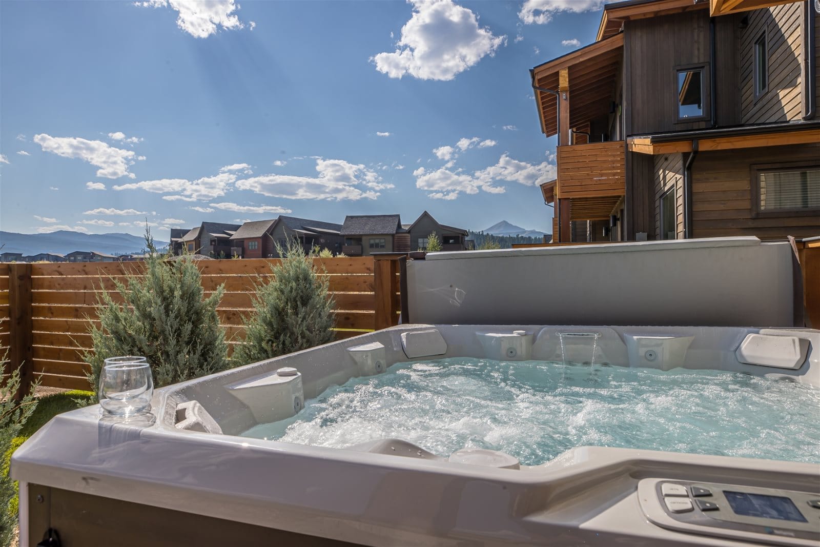 Outdoor hot tub with mountain view.