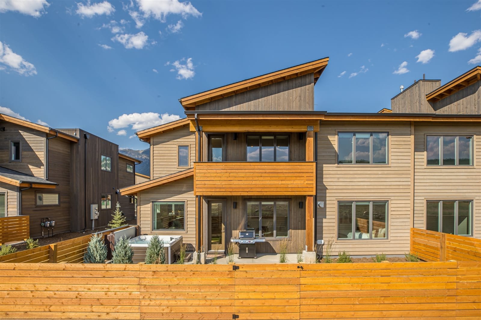 Modern townhouse with wooden elements.