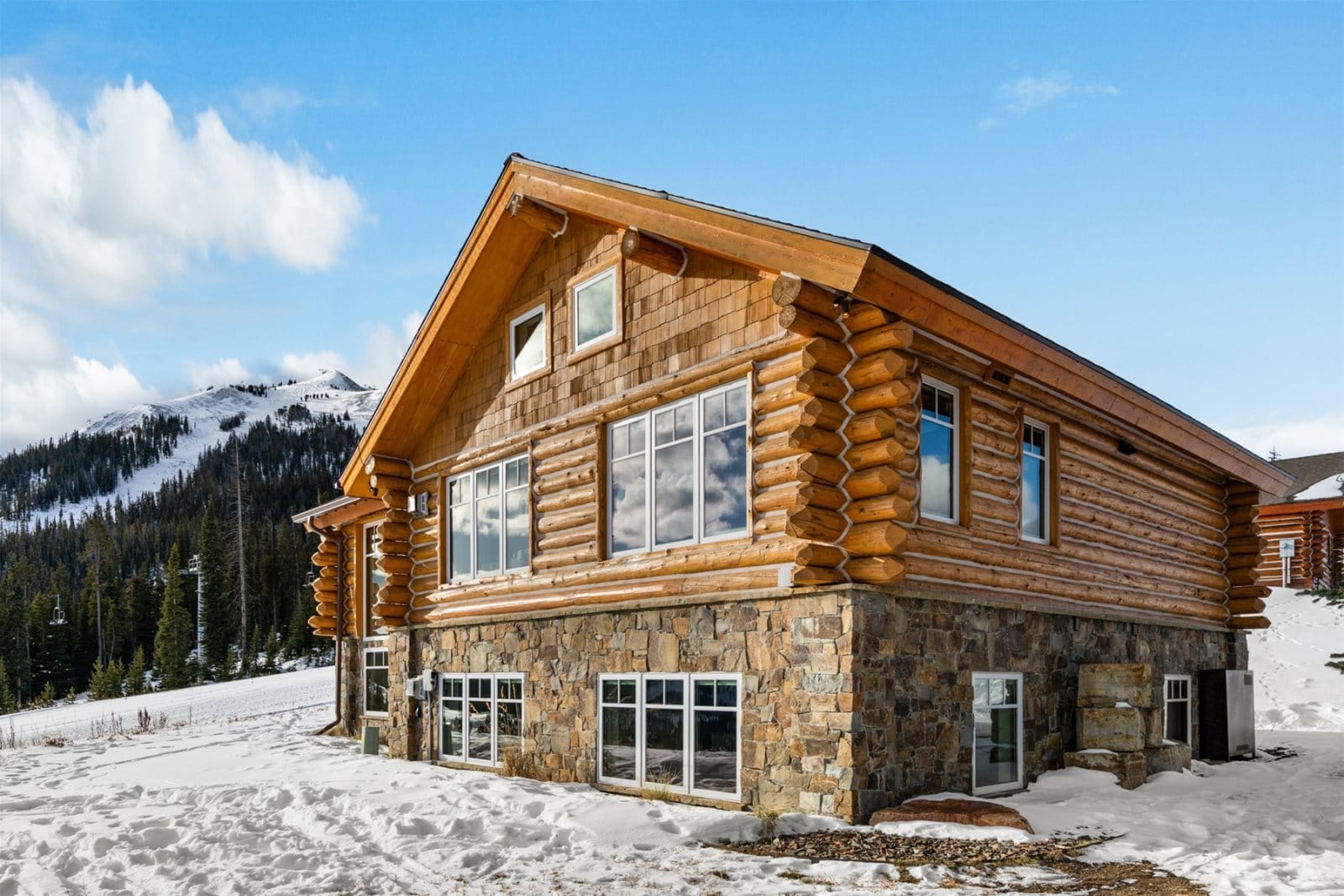 Log cabin in snowy mountains.