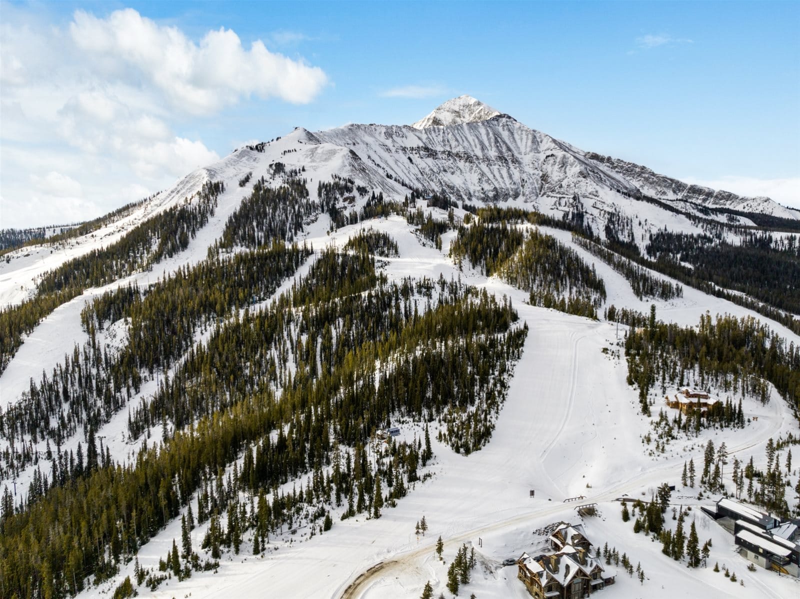 Snowy mountain with ski slopes.