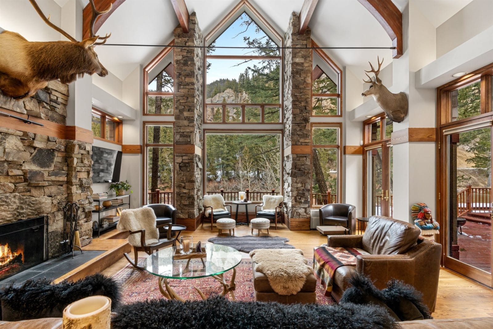 Rustic living room with large windows.