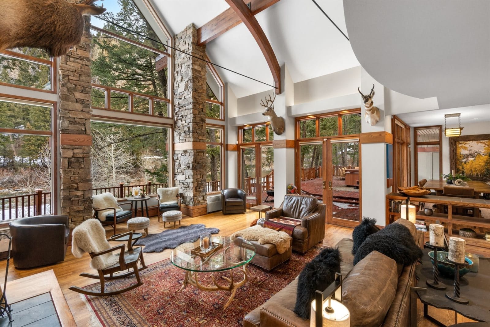 Rustic living room with large windows.