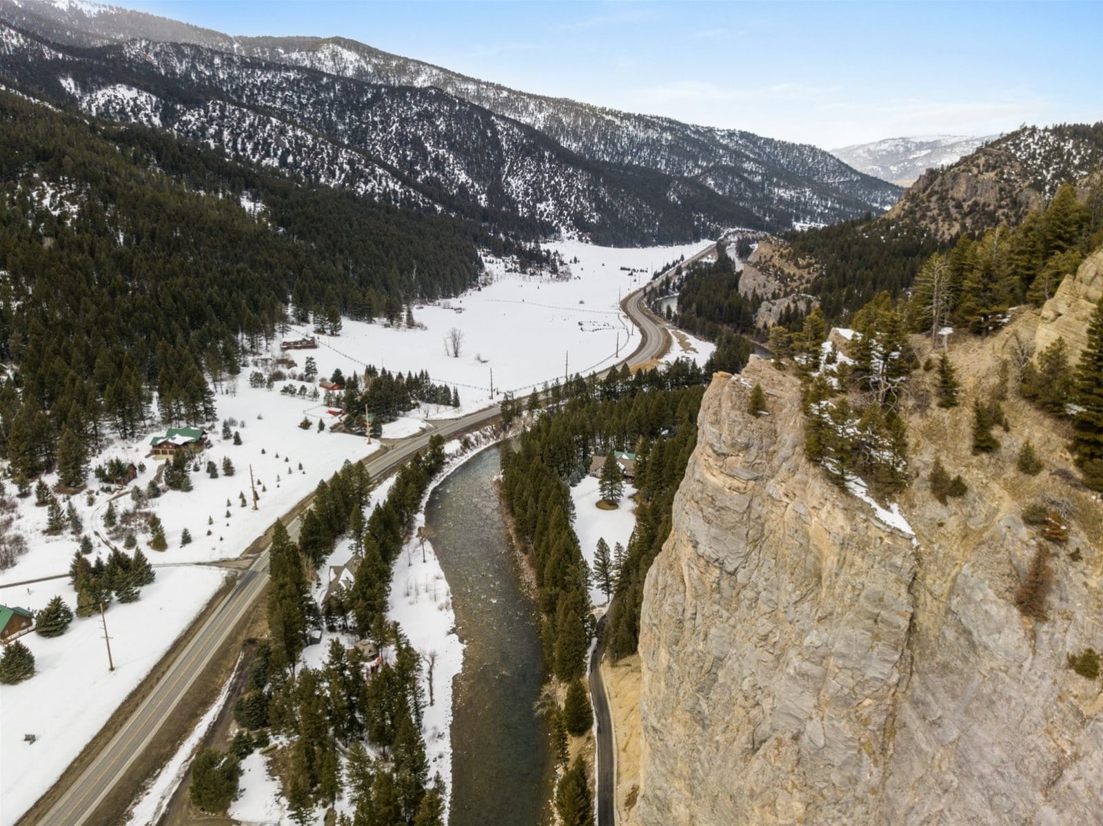 Snowy mountain landscape with river.