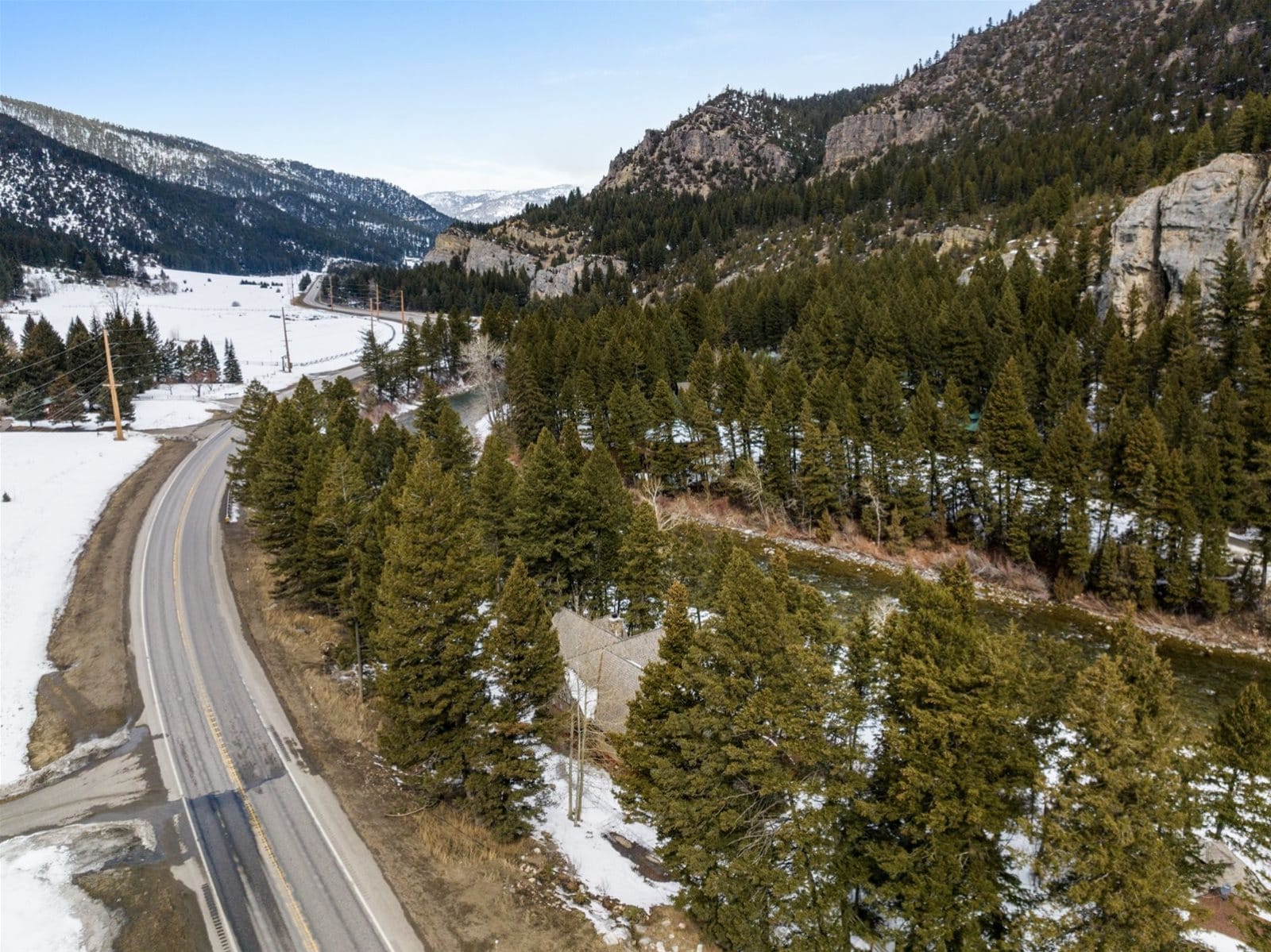 Snowy mountain road and forest.