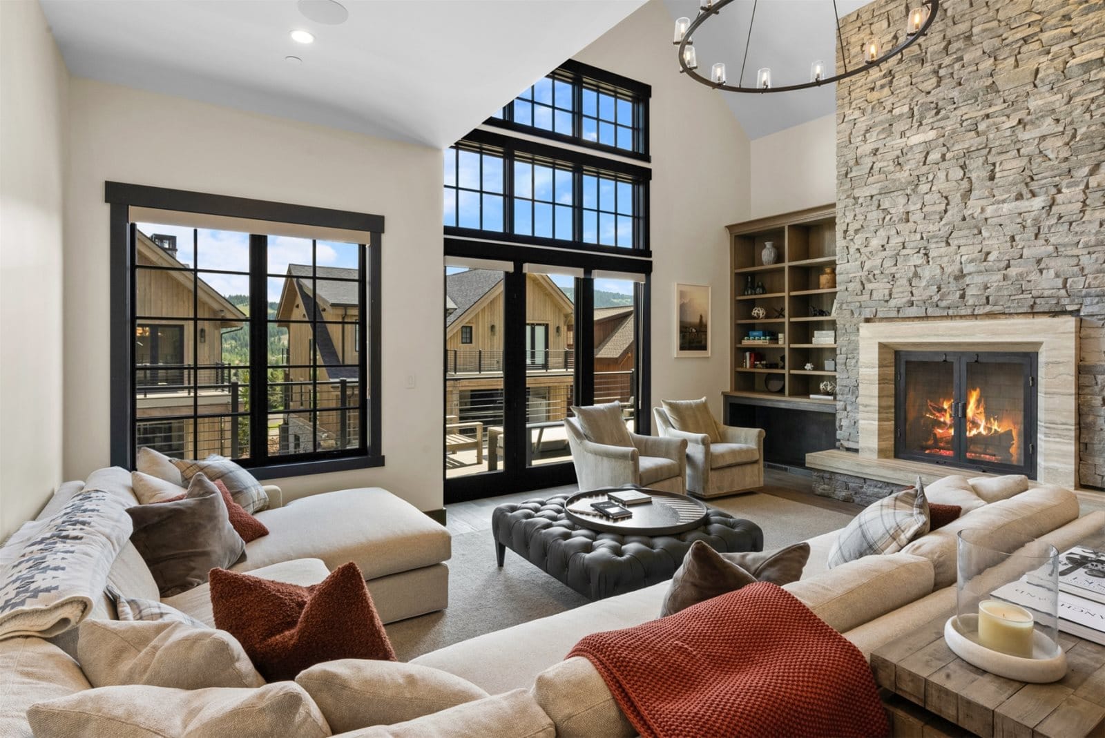 Modern living room with stone fireplace.