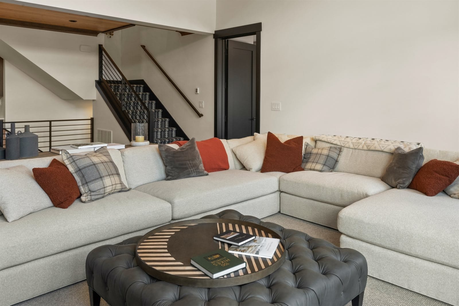 Modern living room with staircase.