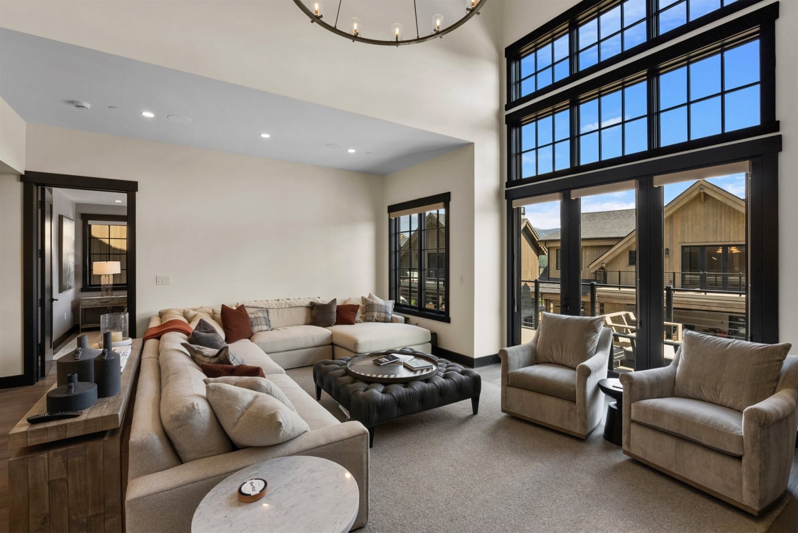 Modern living room with large windows.