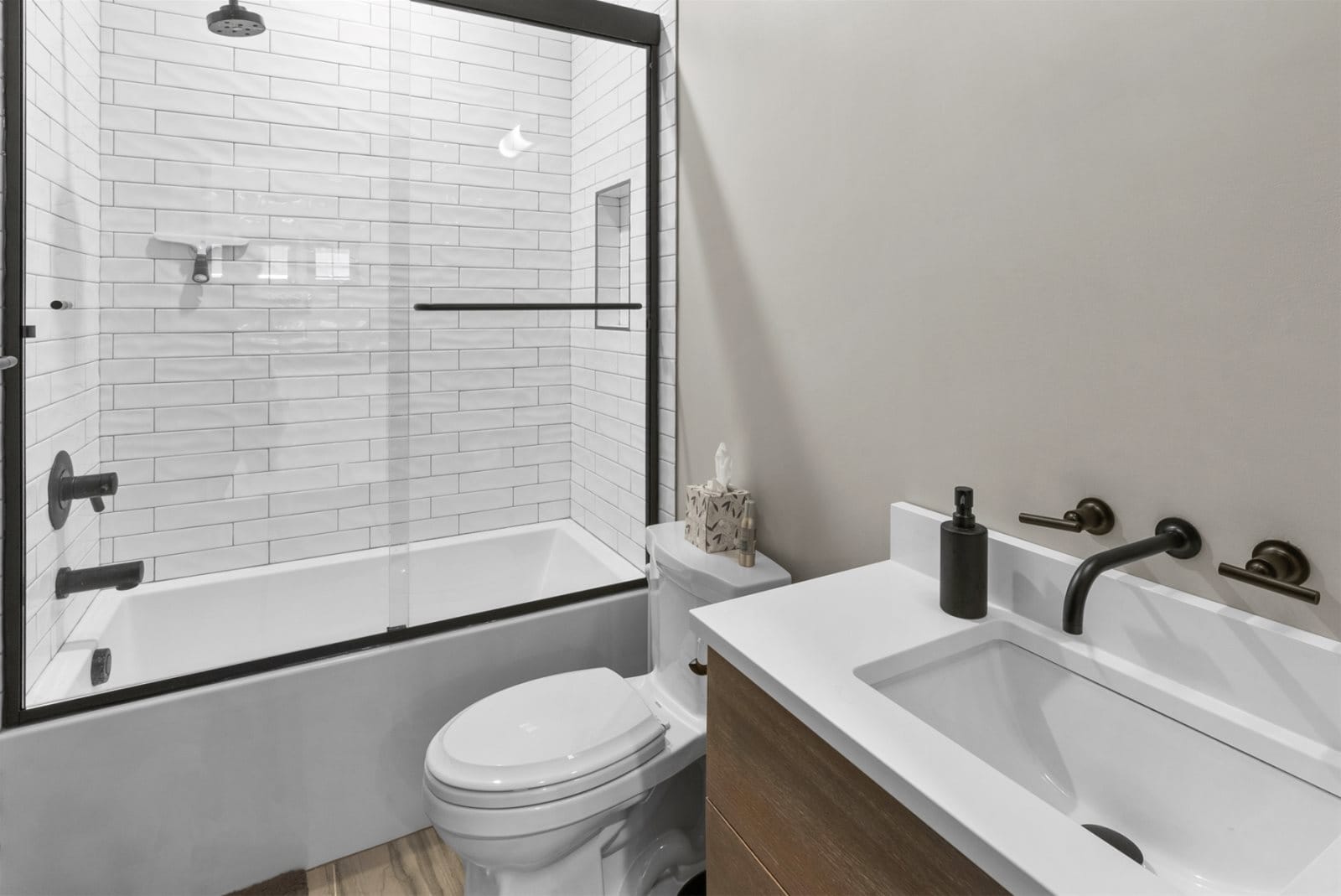 Modern bathroom with shower-tub combo.