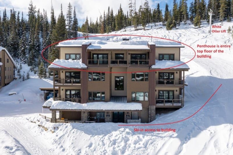 Snowy residential building with ski access.