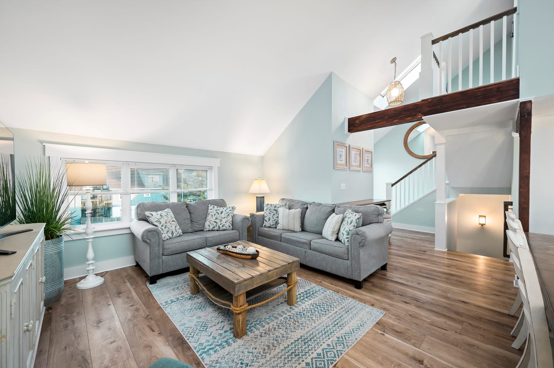 Cozy living room with staircase.