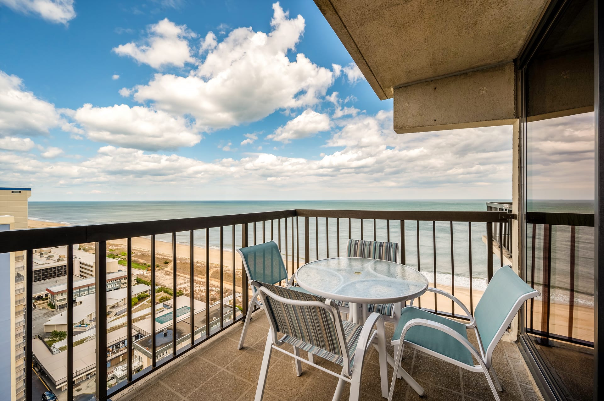 Balcony with beach and ocean view.