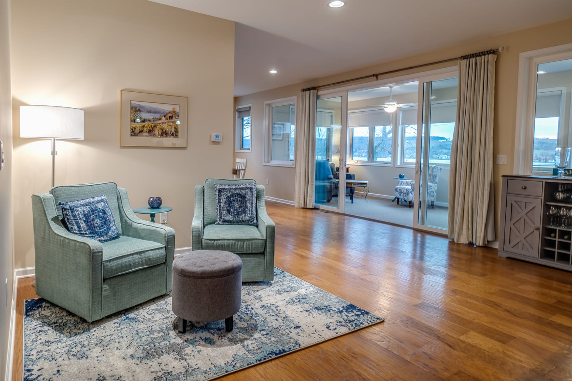 Cozy living area with teal chairs.