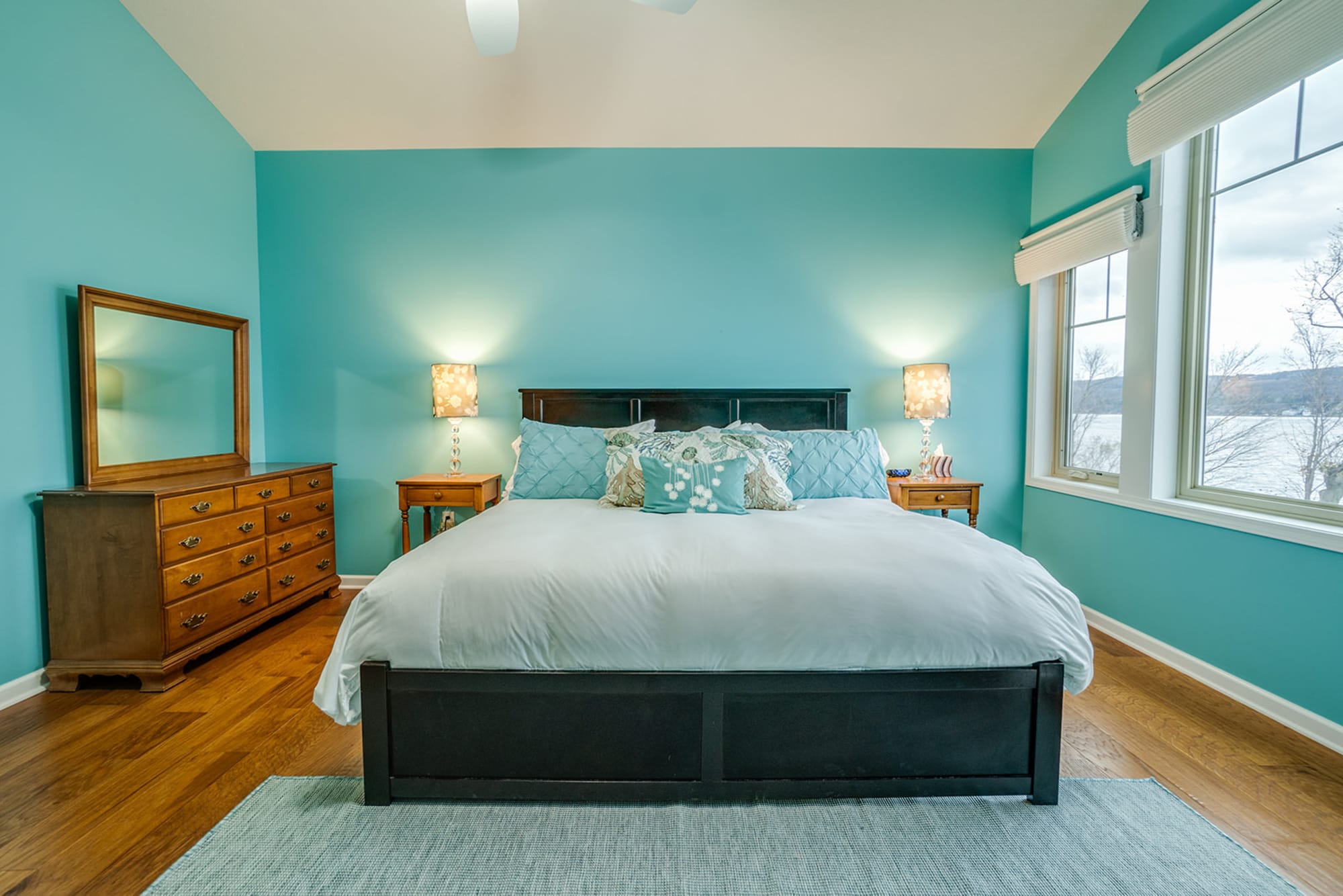 Turquoise bedroom with lake view.