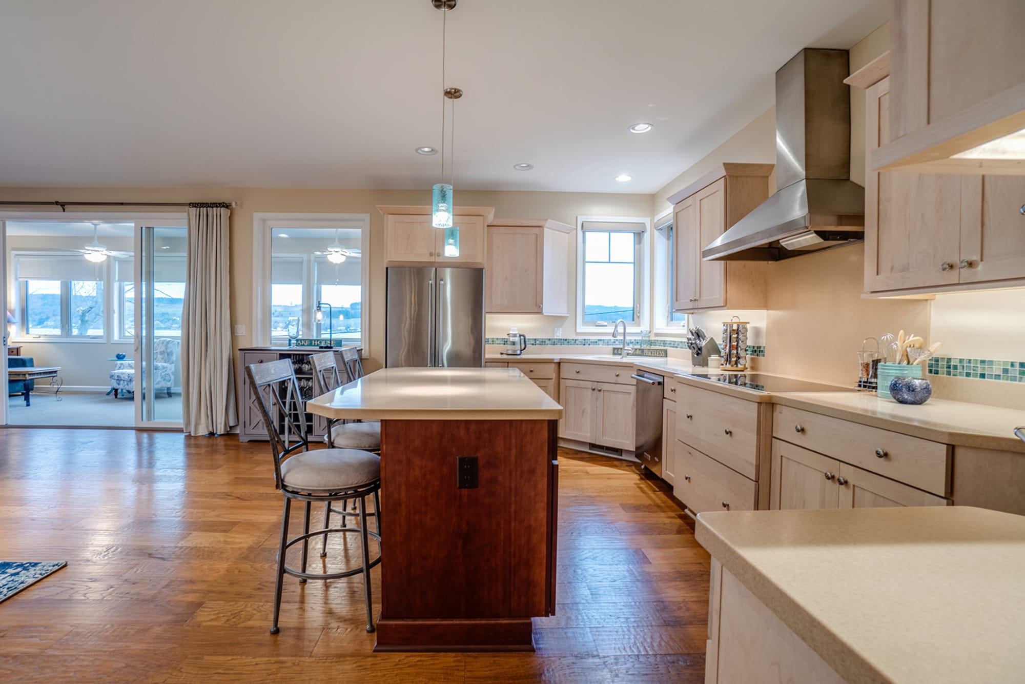 Modern kitchen with island and seating.