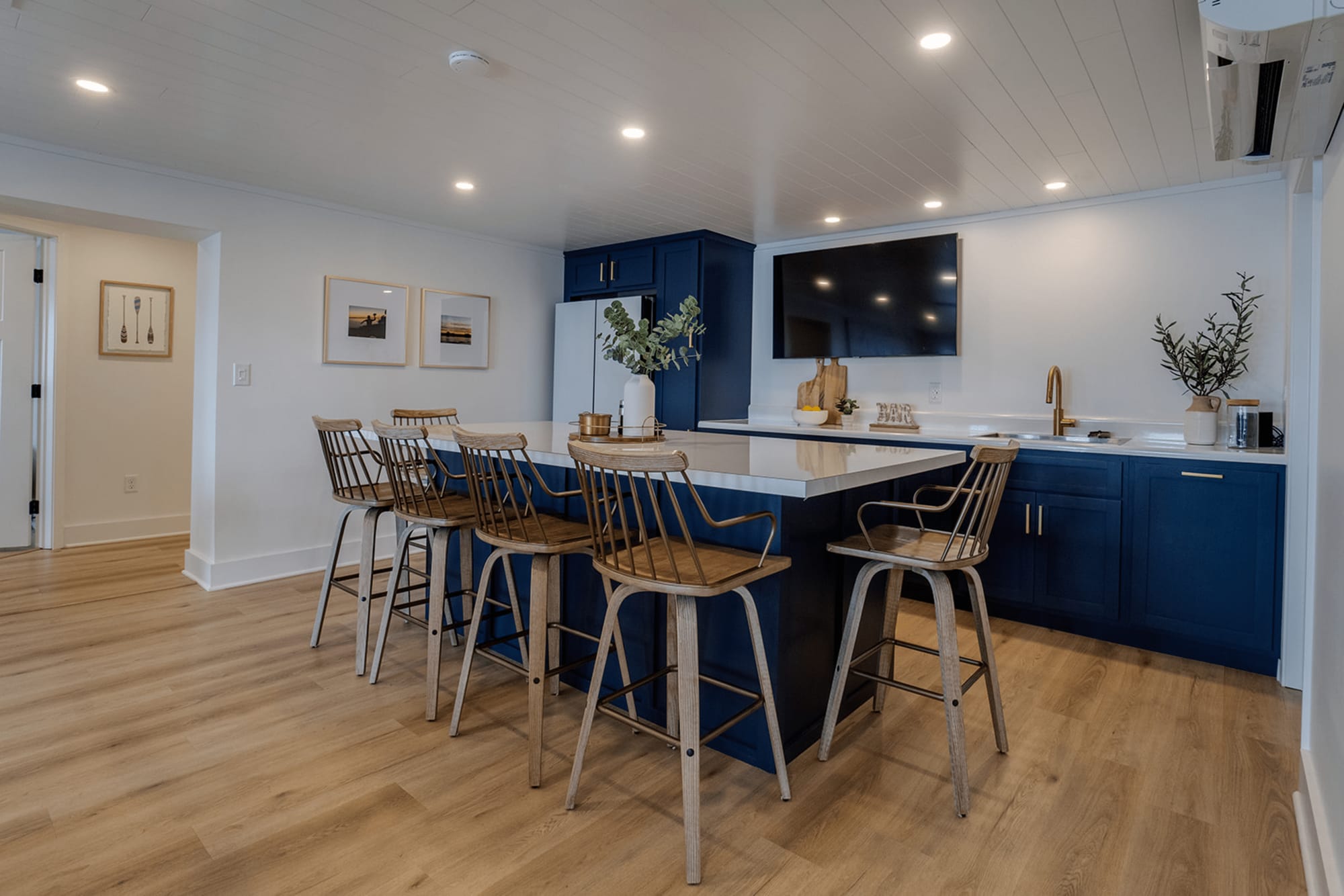 Modern kitchen with blue cabinets.