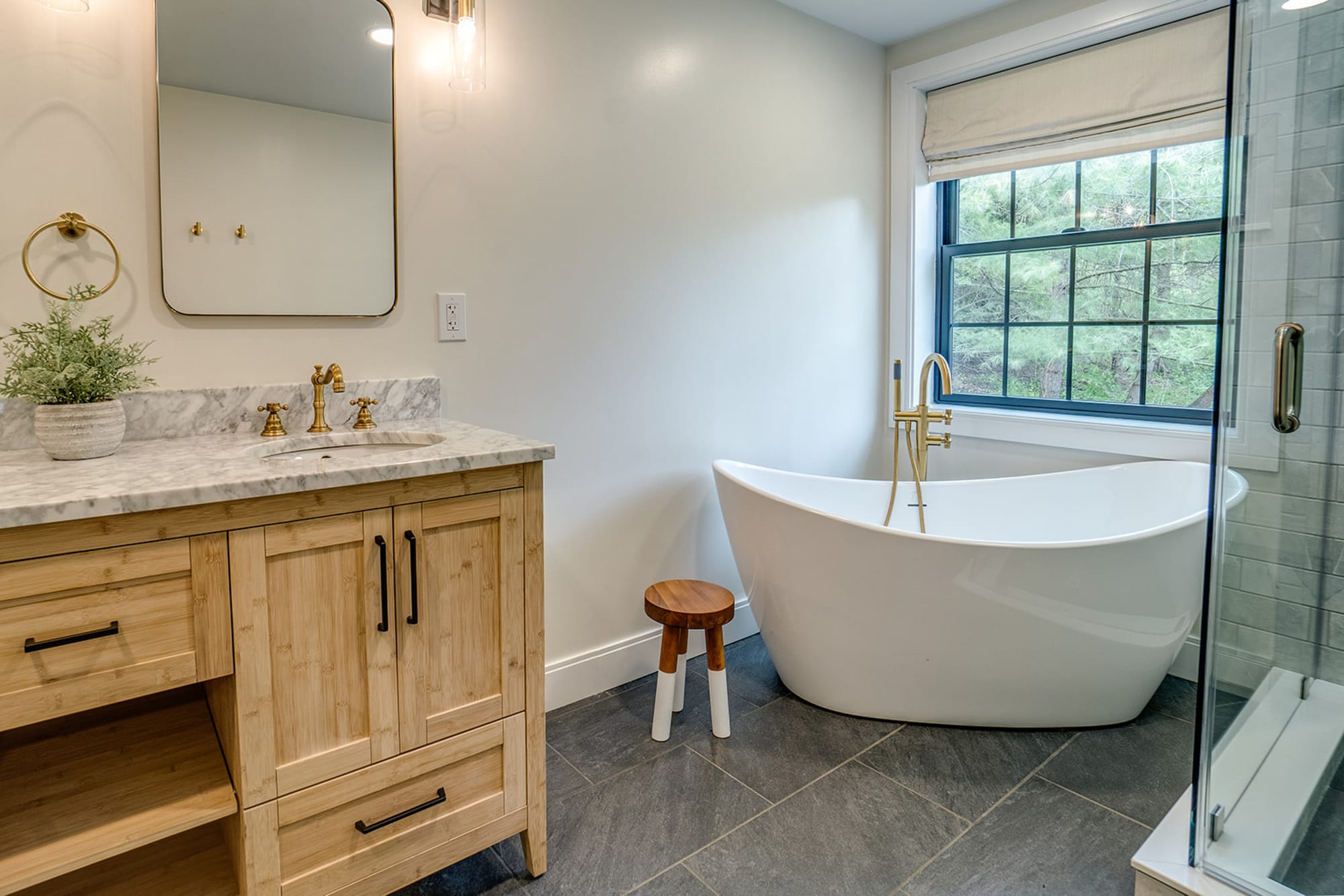 Modern bathroom with freestanding bathtub.