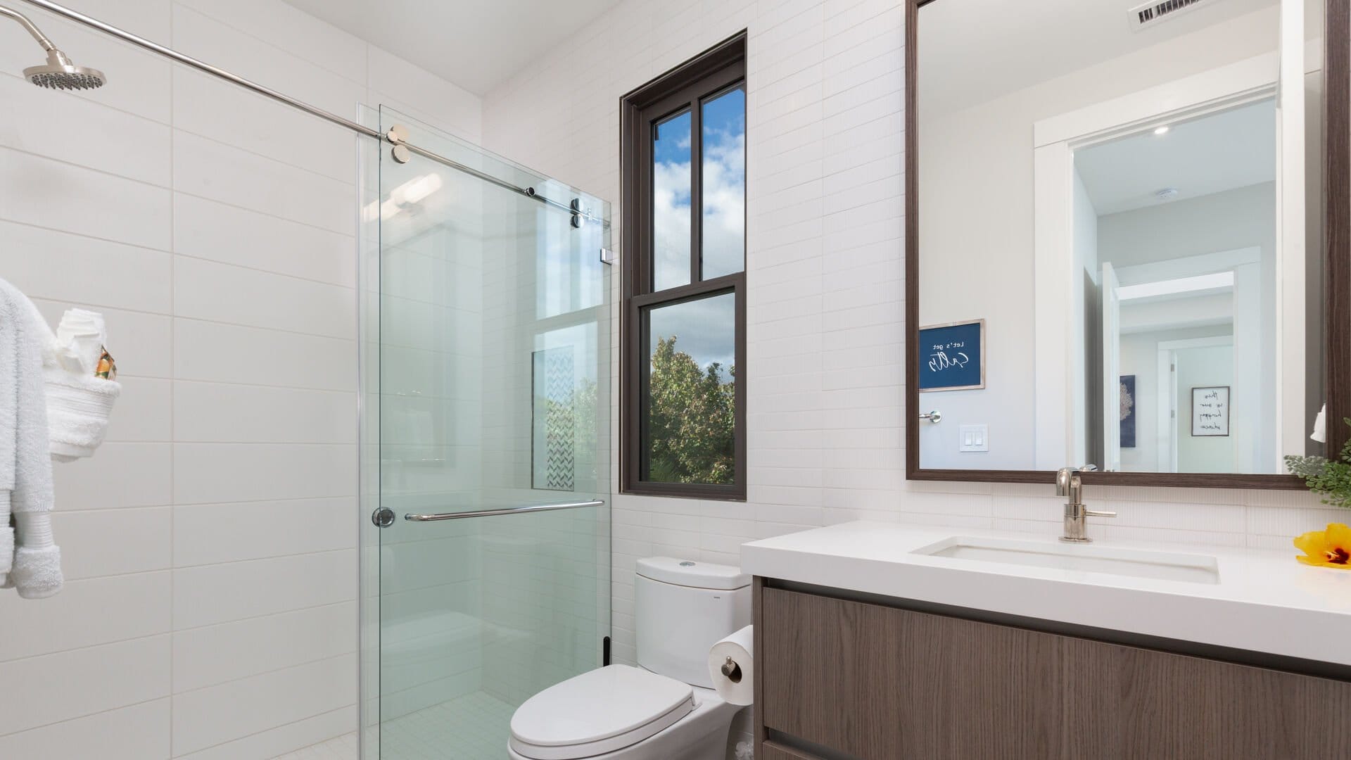 Modern bathroom with glass shower door.