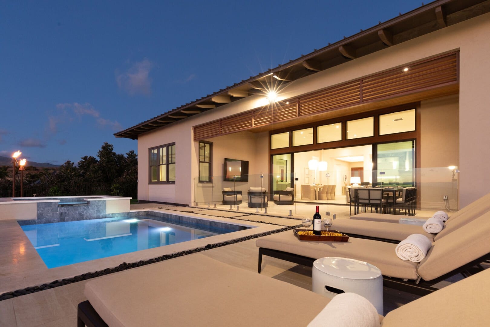 Modern house with pool at dusk.