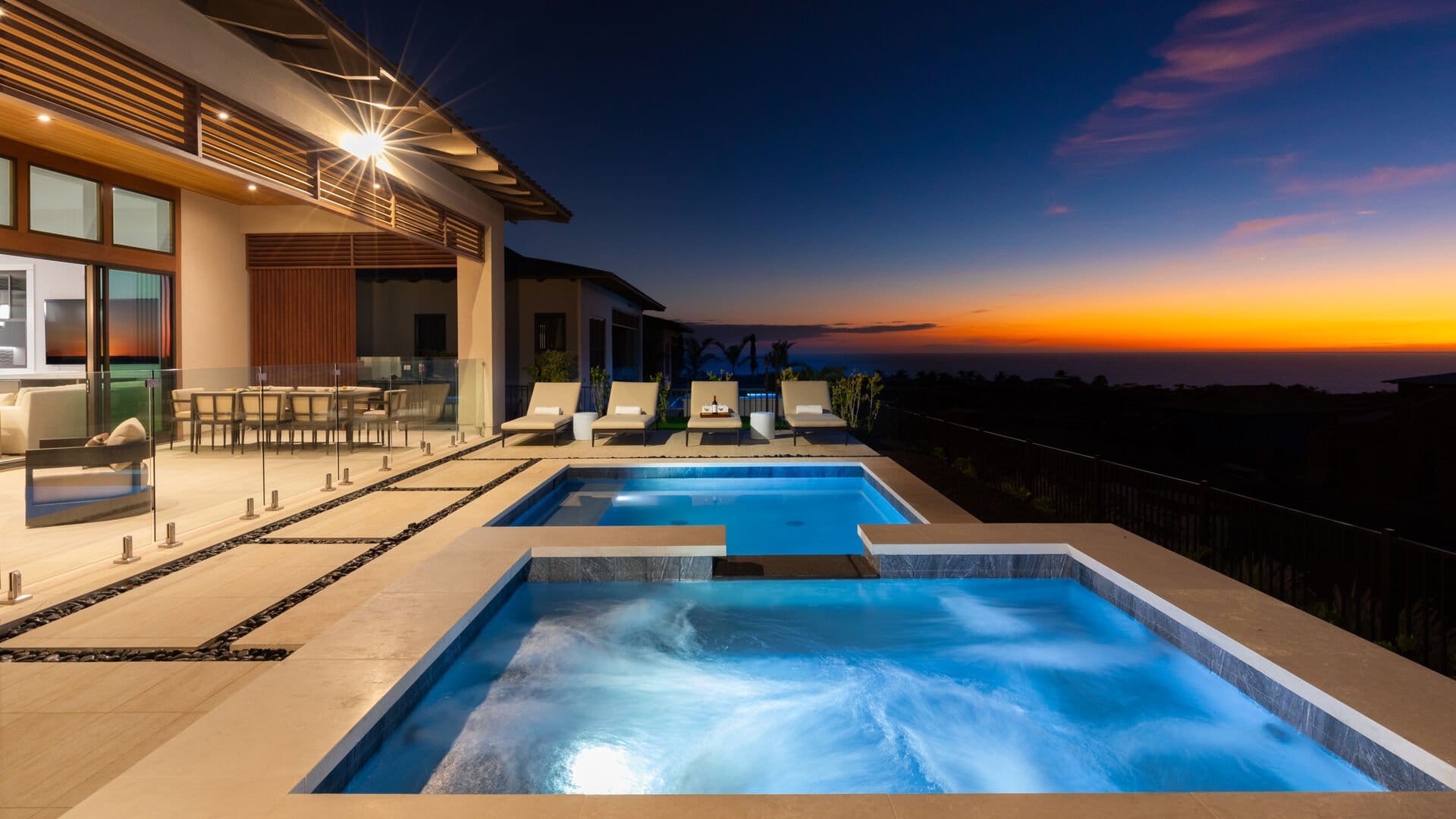 Luxury pool patio at sunset.