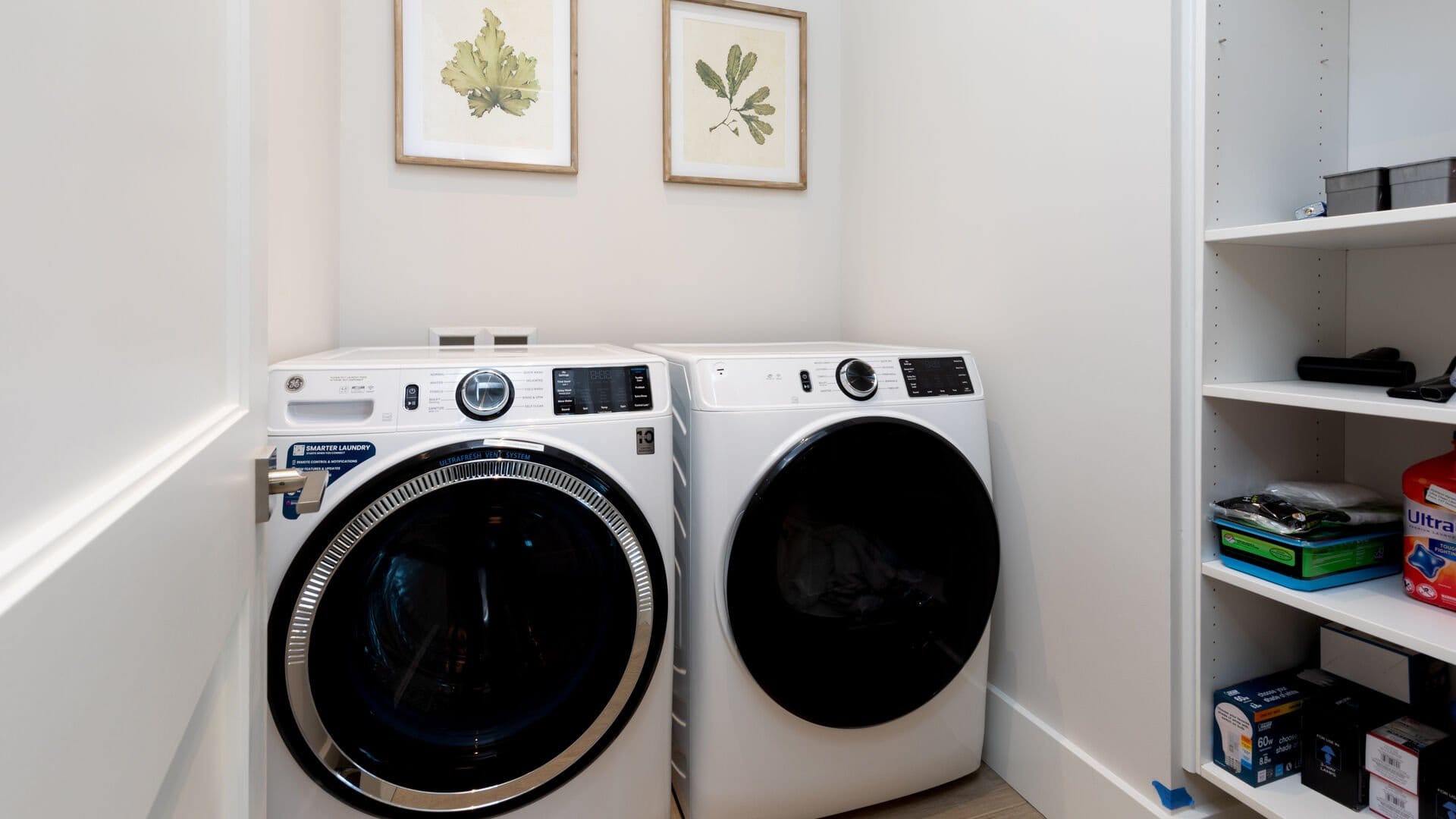 Laundry room with appliances and shelves