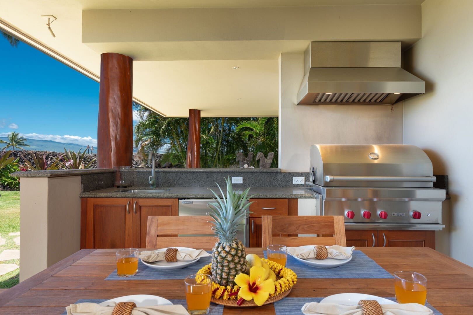 Outdoor kitchen with pineapple centerpiece.