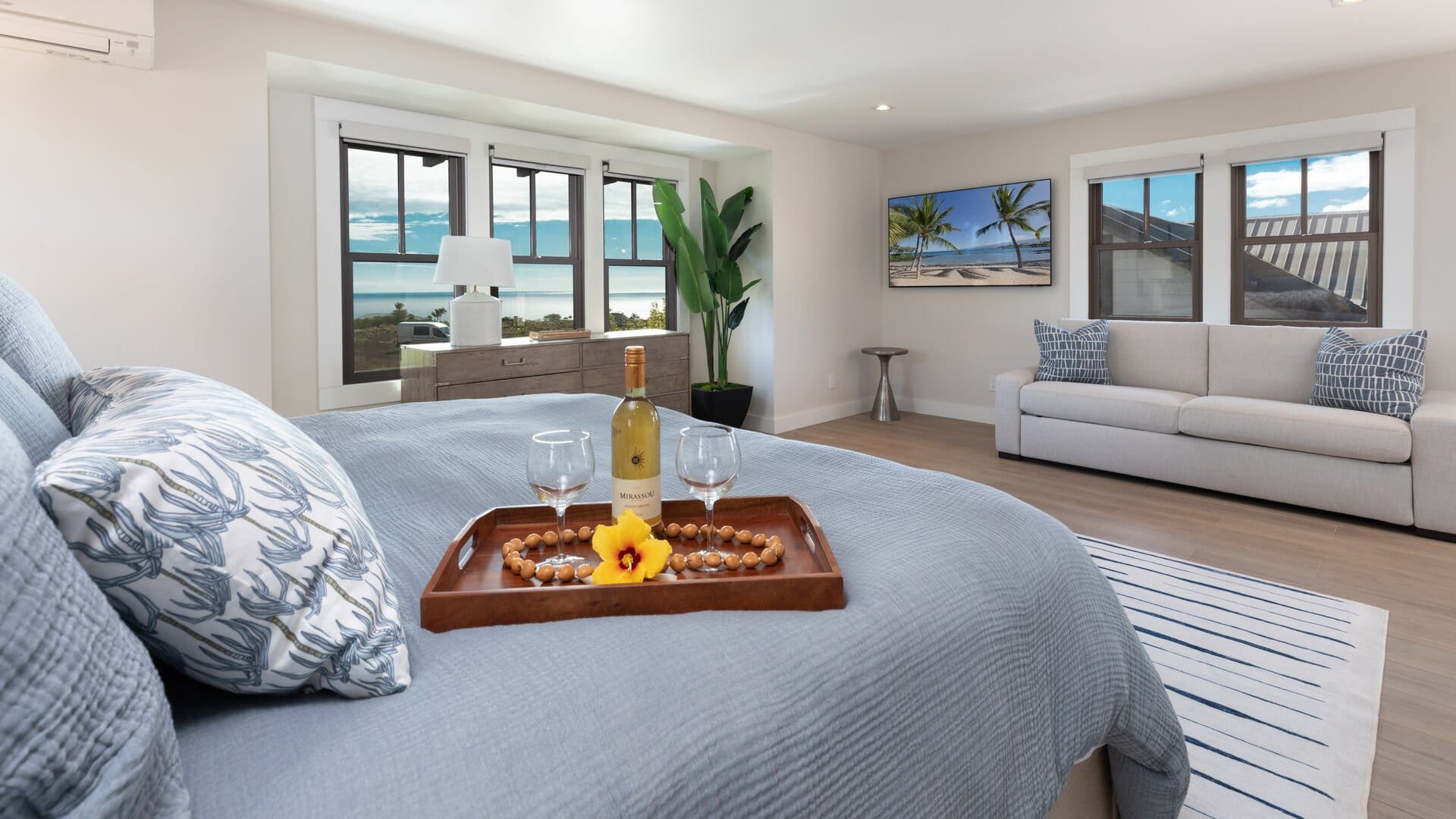 Bedroom with ocean view windows.