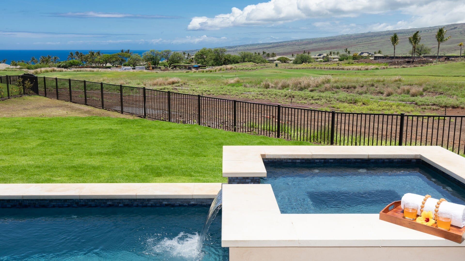 Swimming pool and garden with view.