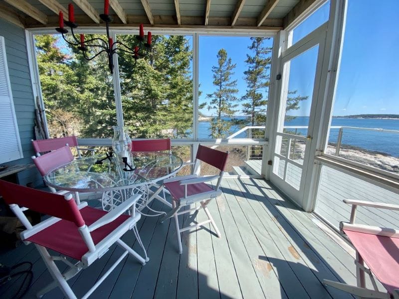 Screened porch with ocean view.