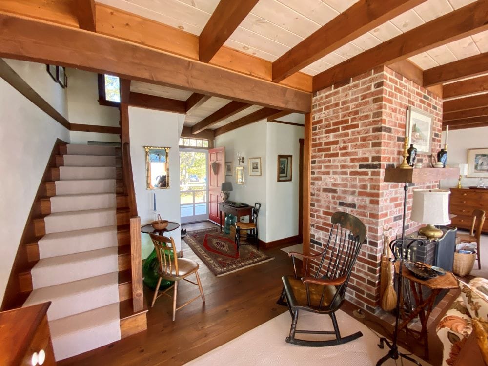 Cozy living room with staircase.