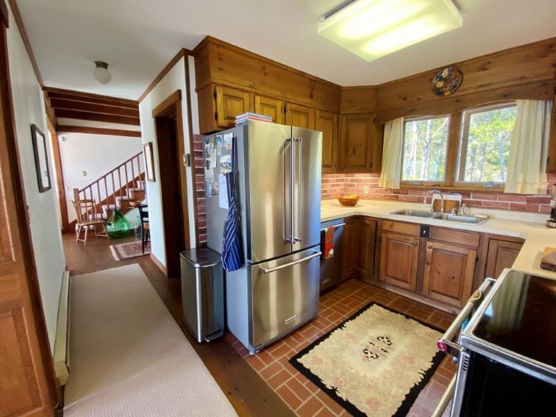 Cozy kitchen with wooden cabinets.