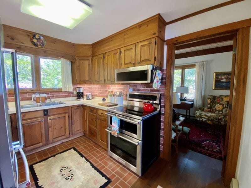 Cozy kitchen with wooden cabinets.