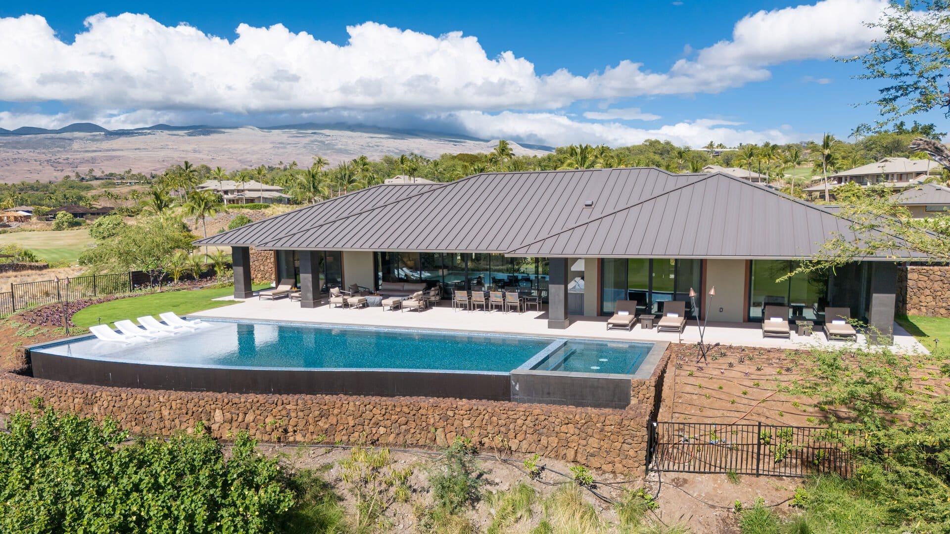 Modern house with pool, mountains backdrop