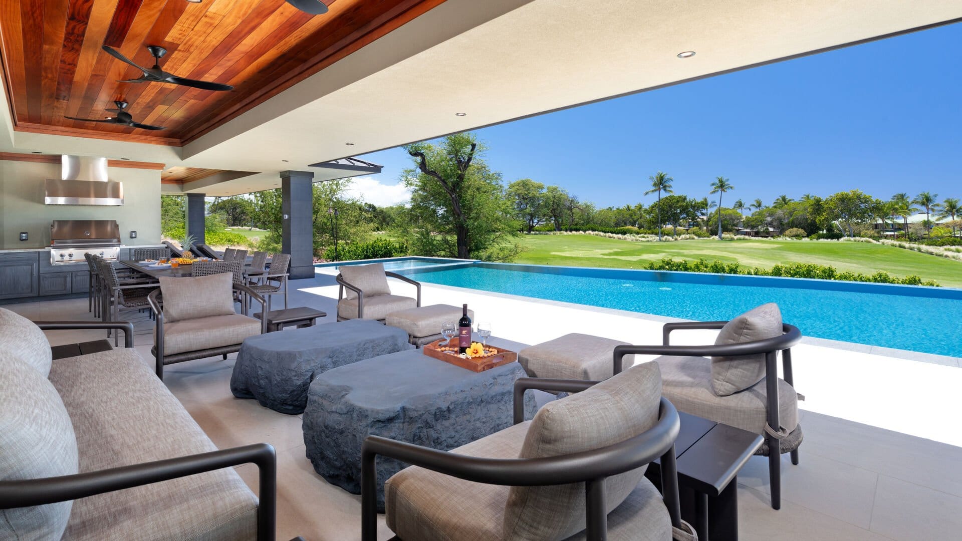 Luxury patio with pool and view.