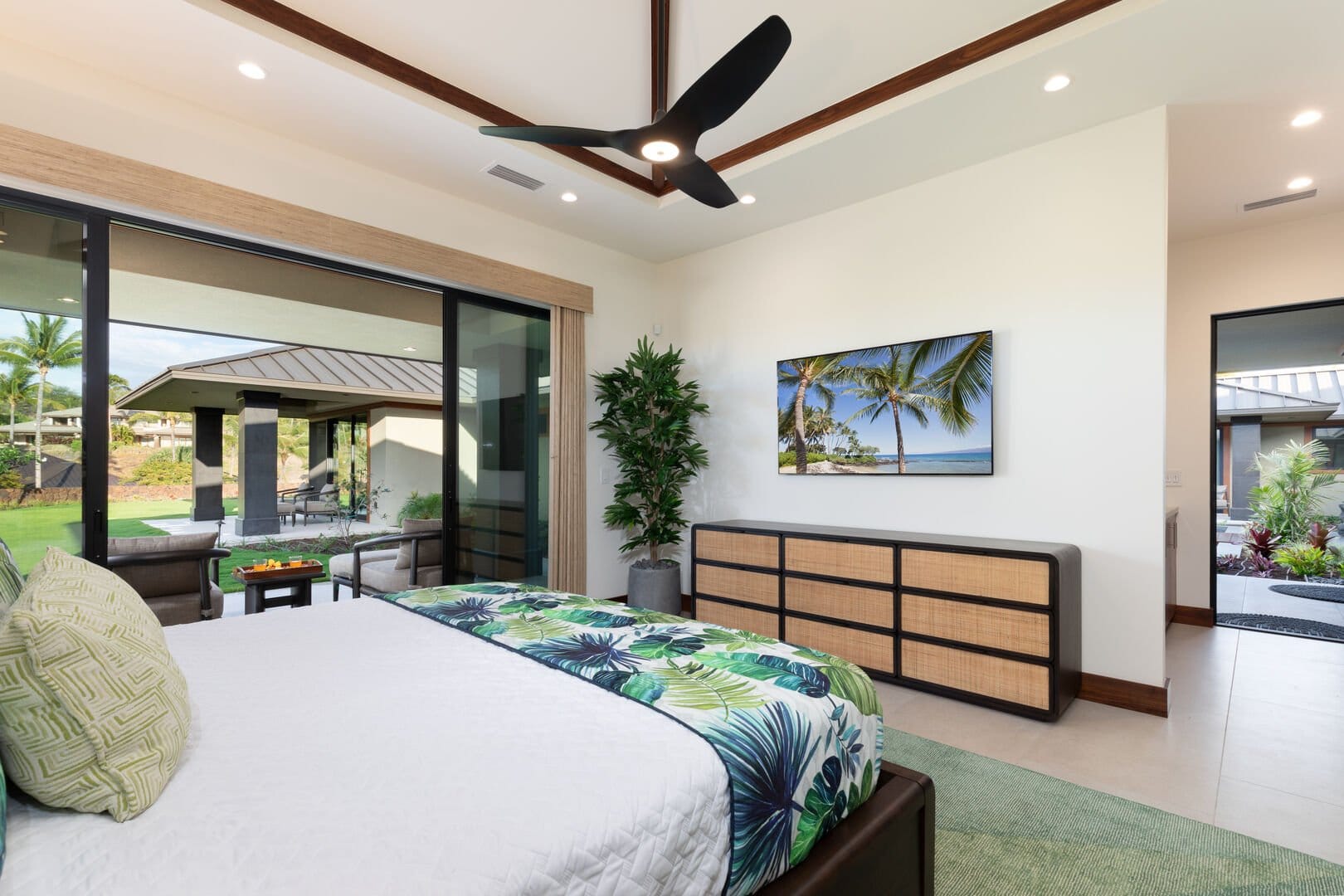 Modern bedroom with tropical decor.