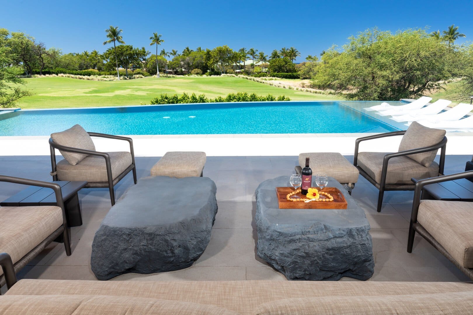 Poolside seating with lush view