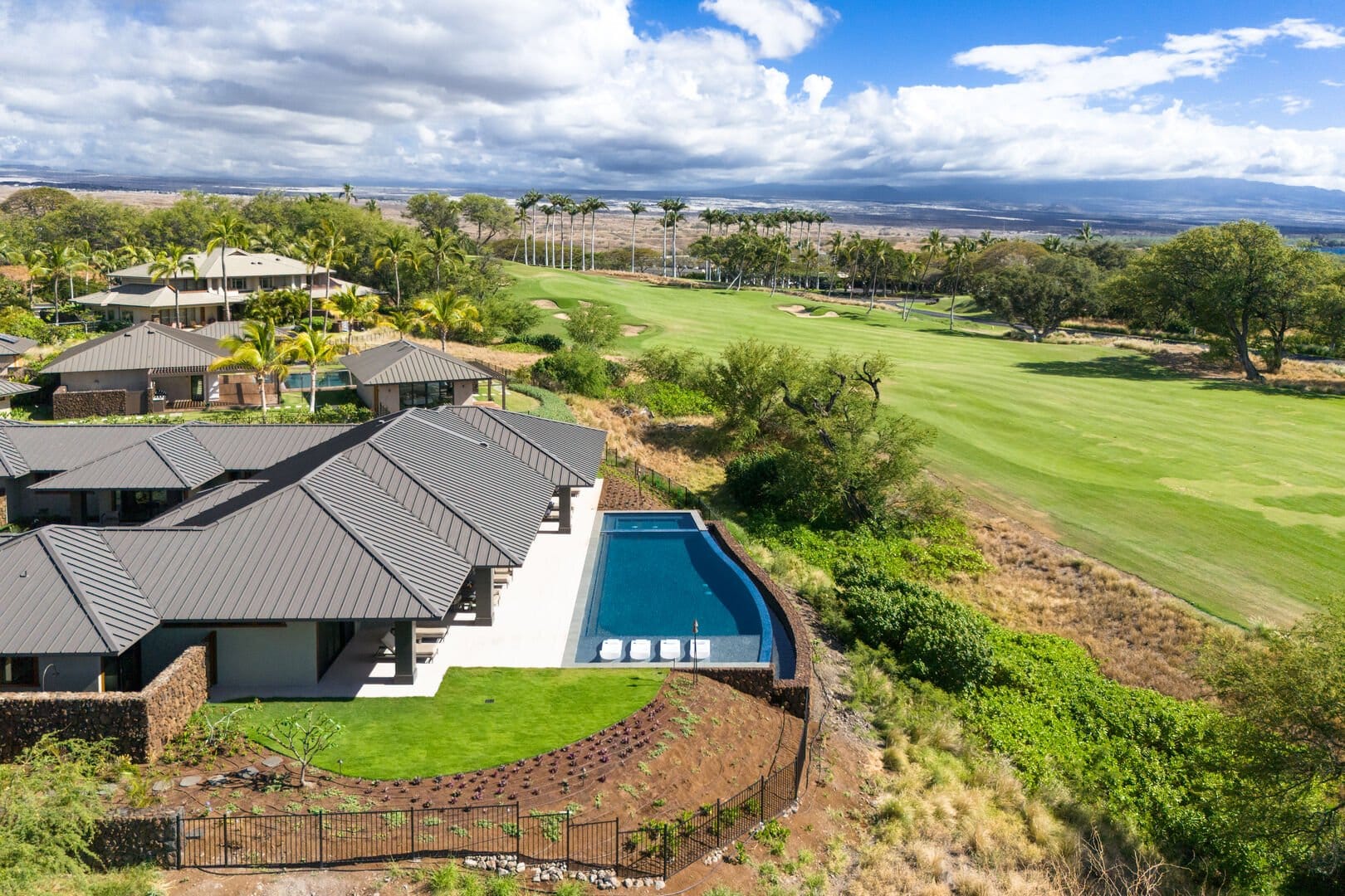 Modern house with pool, golf course.