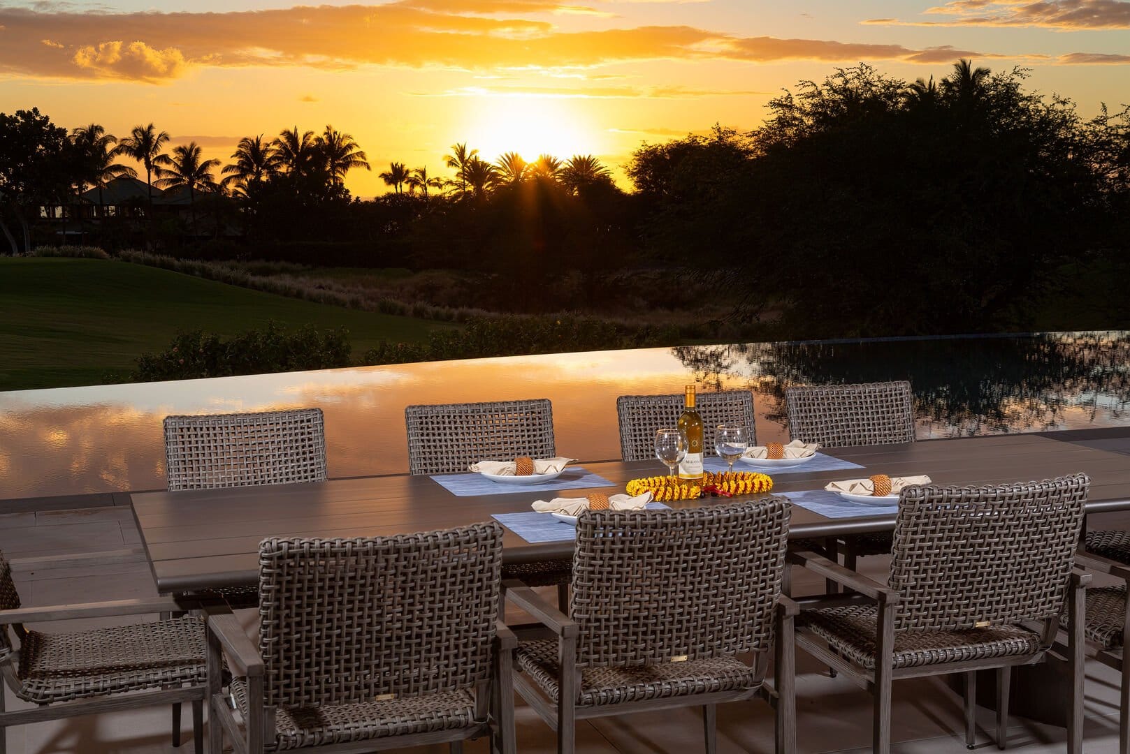 Outdoor dining with sunset view.