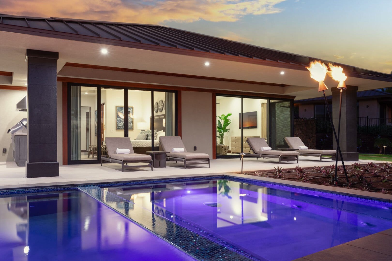 Modern patio and pool at sunset.