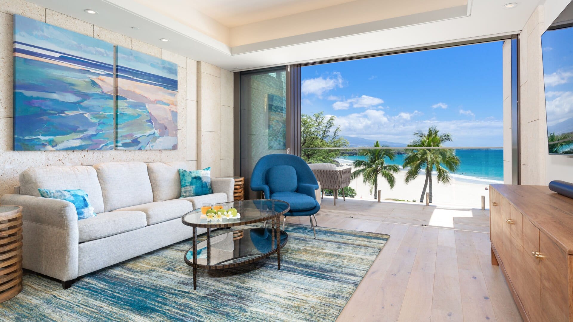 Beachfront living room with ocean view.