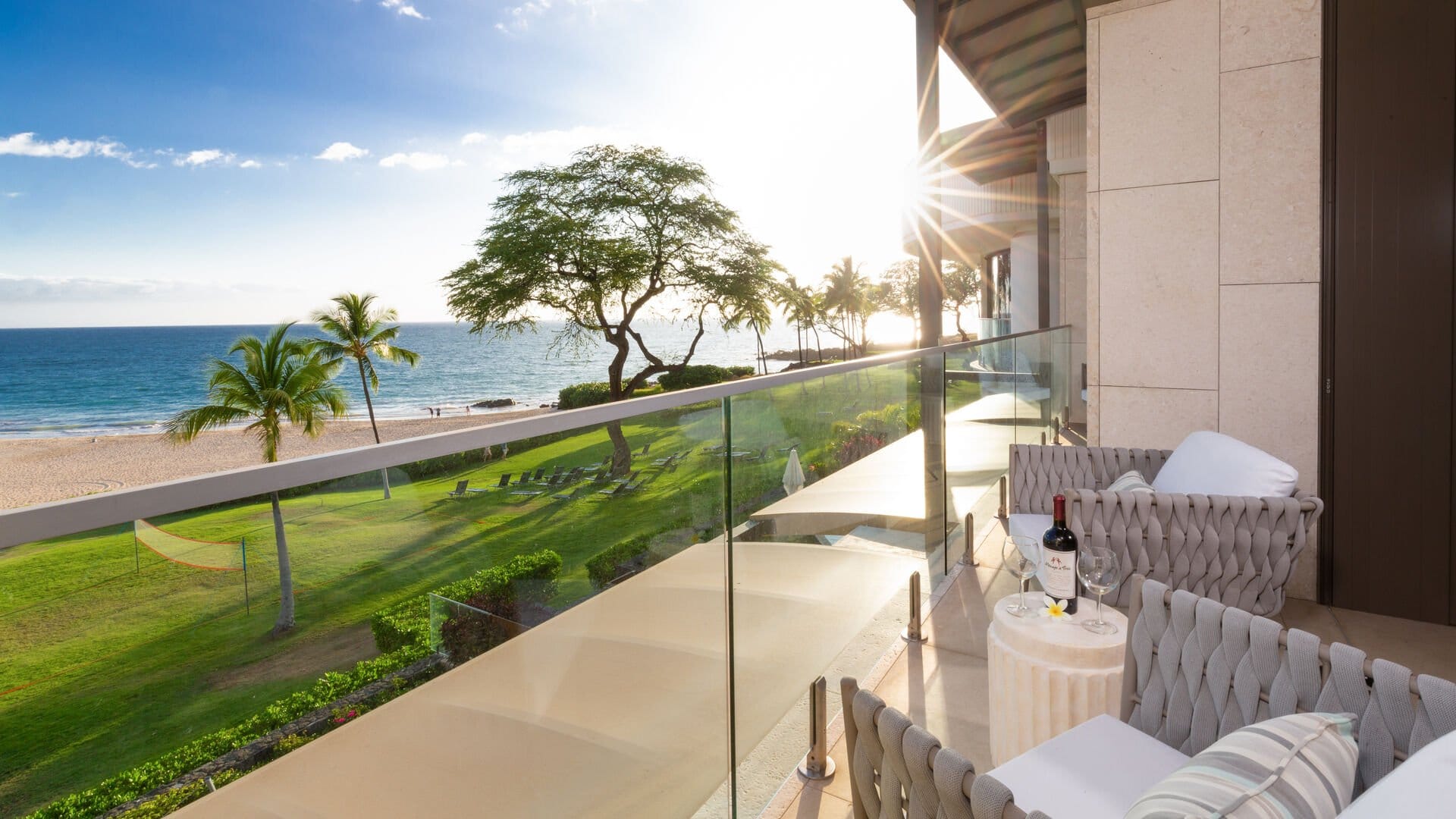 Ocean-view balcony with seating area.