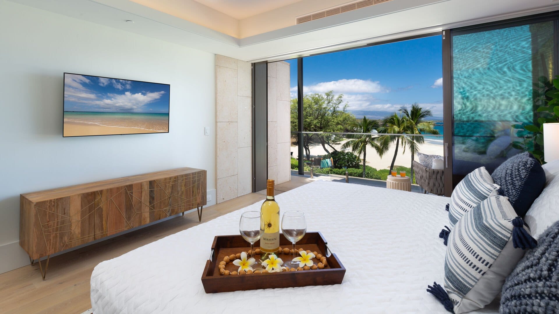 Bedroom with ocean view balcony.