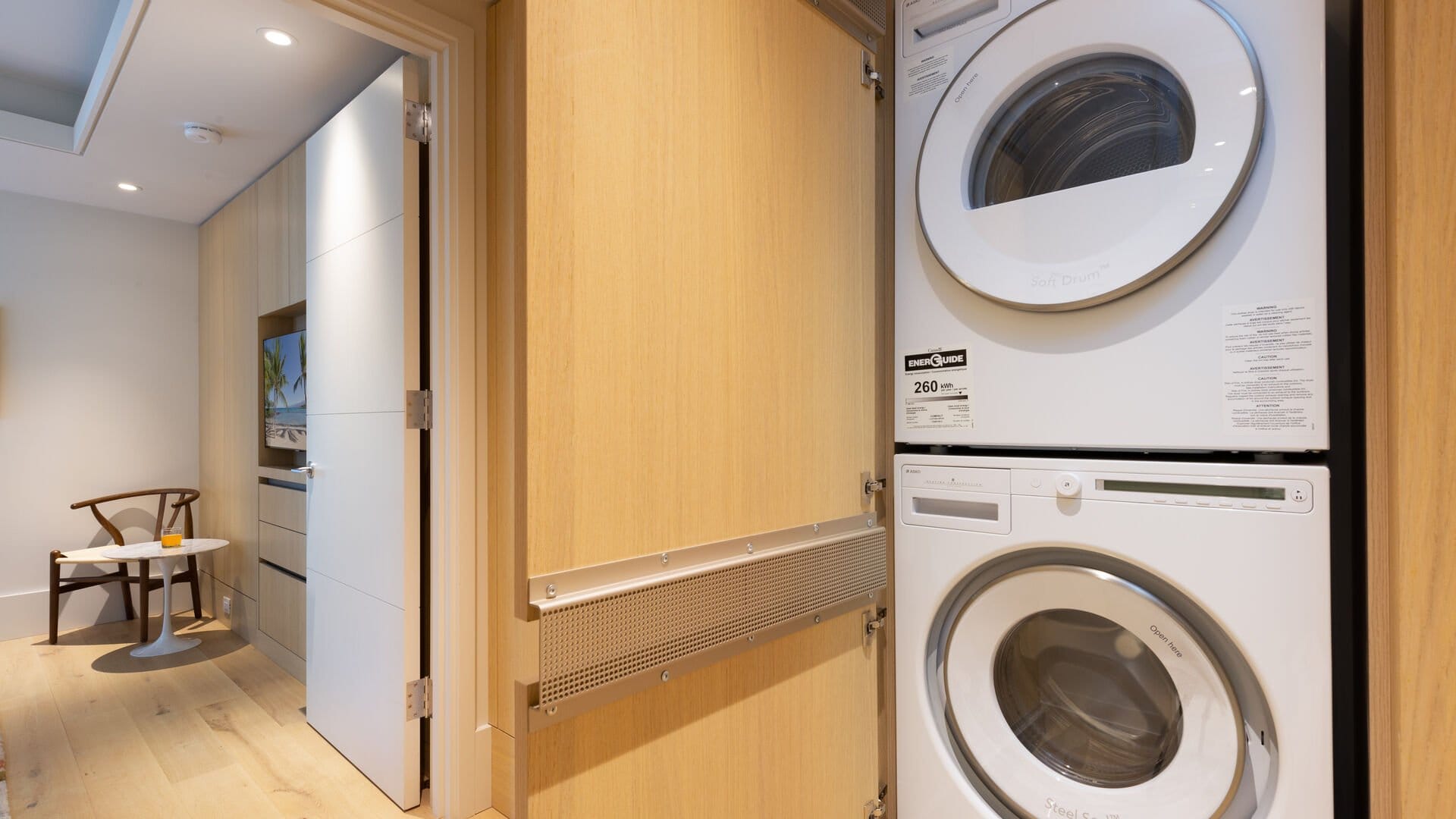 Stacked washer and dryer in closet.