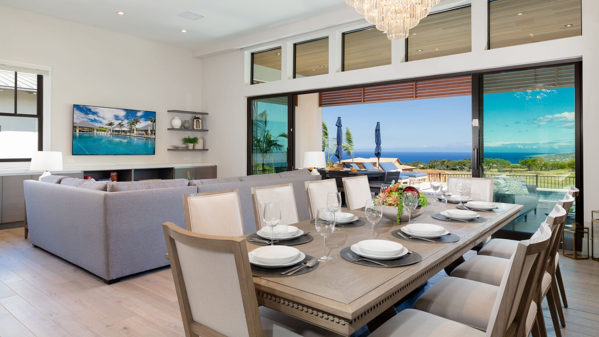 Modern living and dining room, ocean.