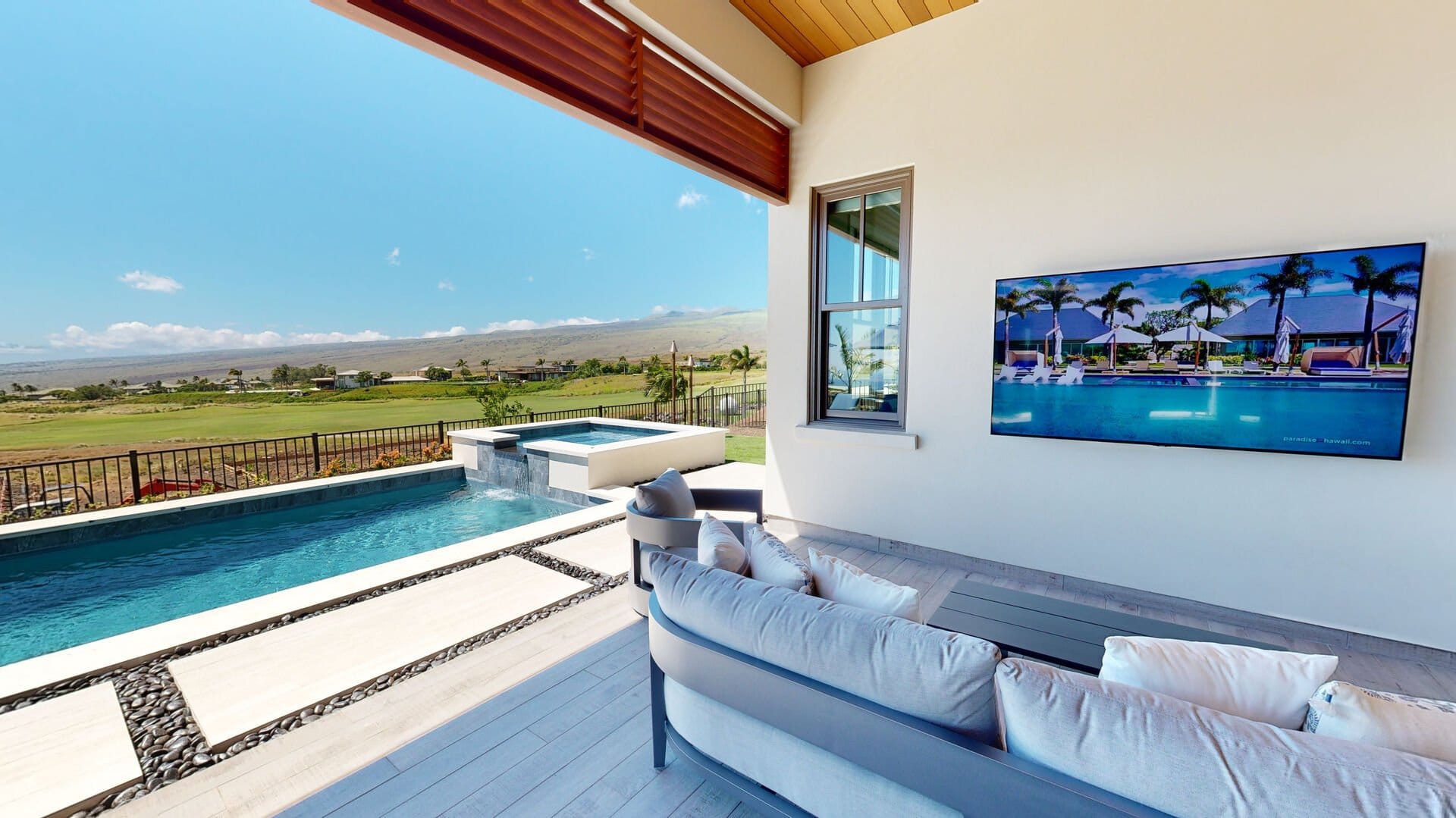 Patio with pool and landscape view.