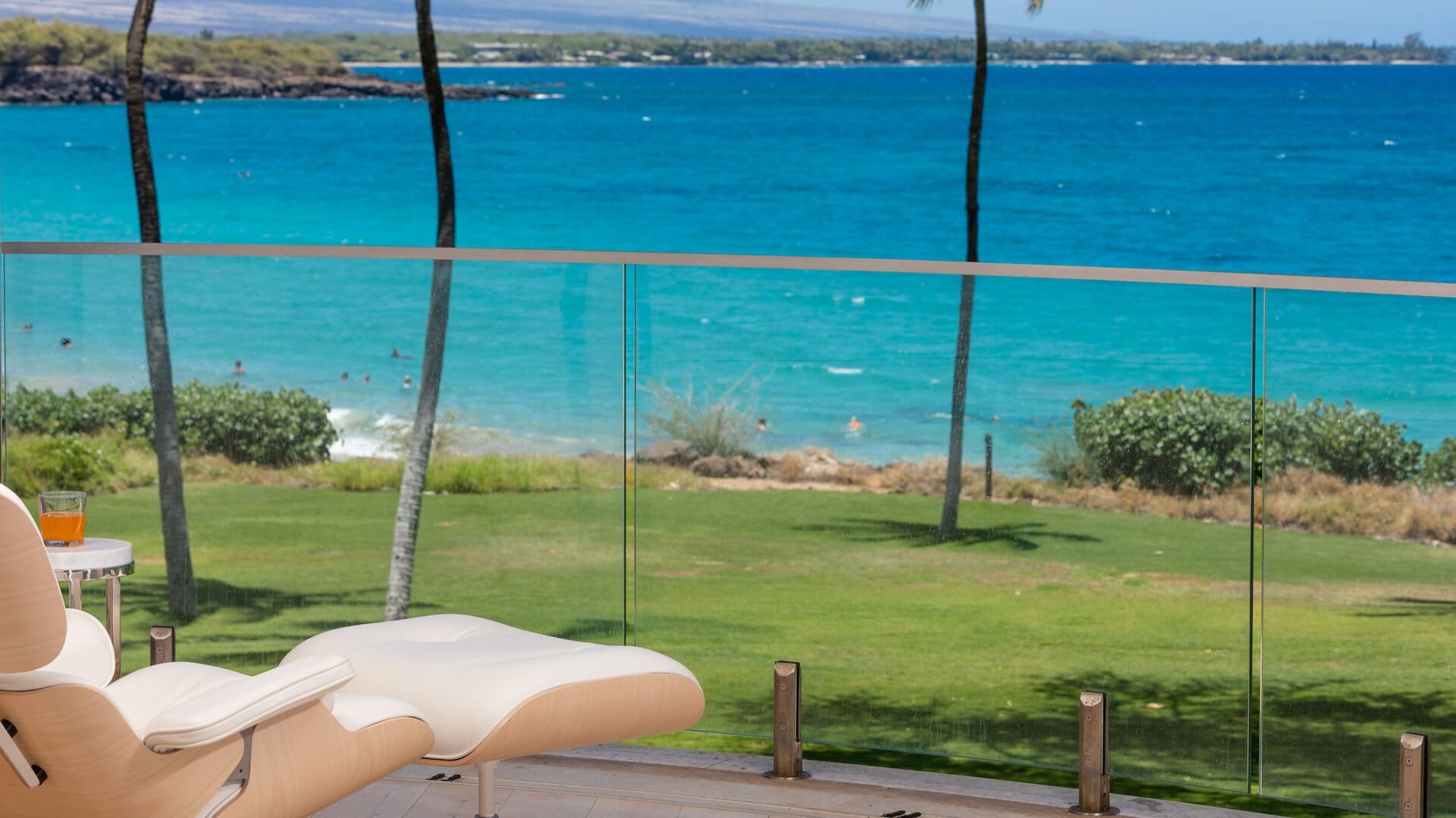 Beachfront view with lounge chair.